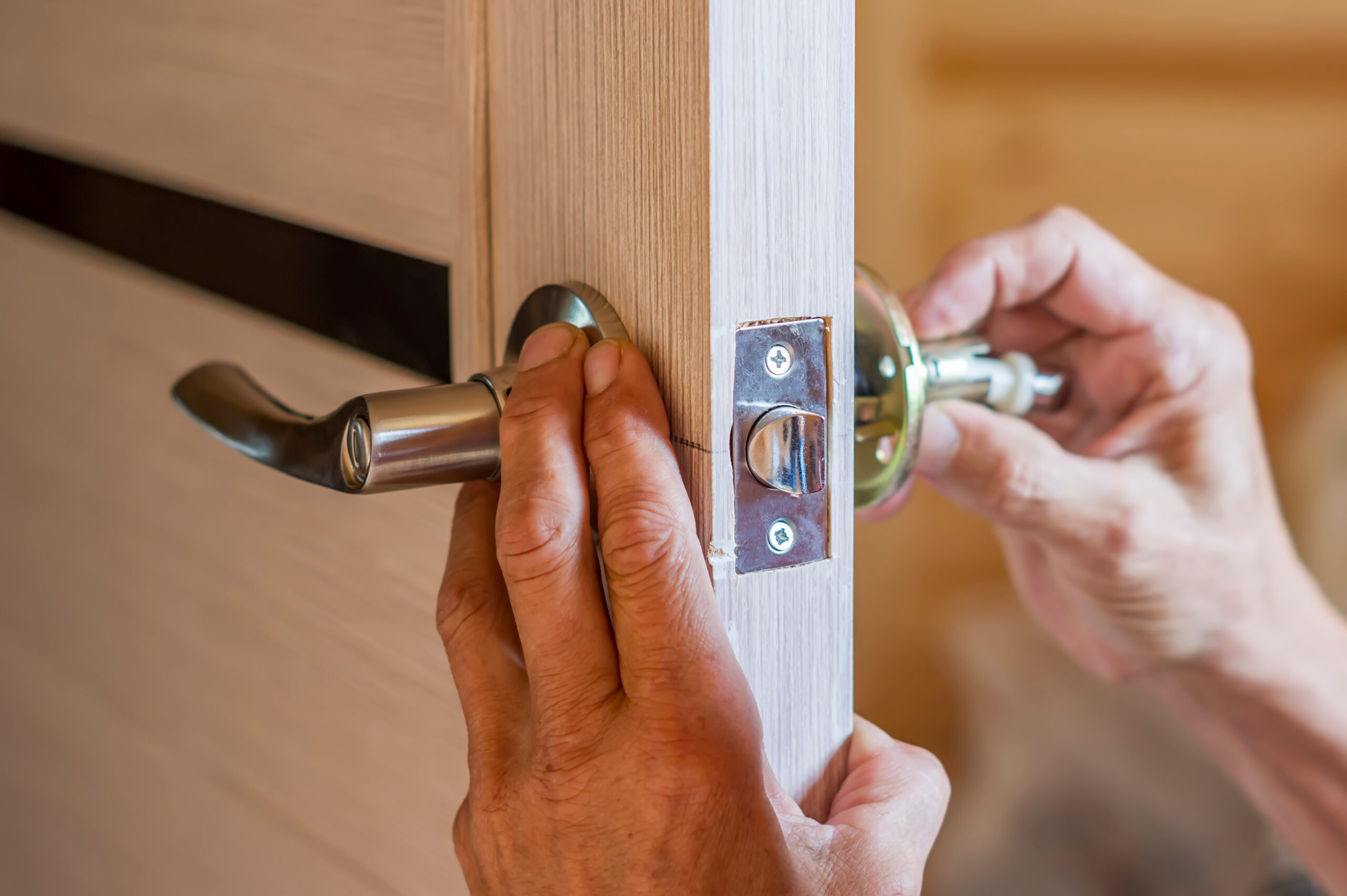 Locksmith doing deadbolt installation